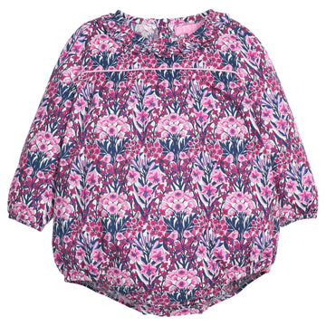 Navy and pink floral-patterned woven baby bubble that features button closure along back of neckline and at stride. 