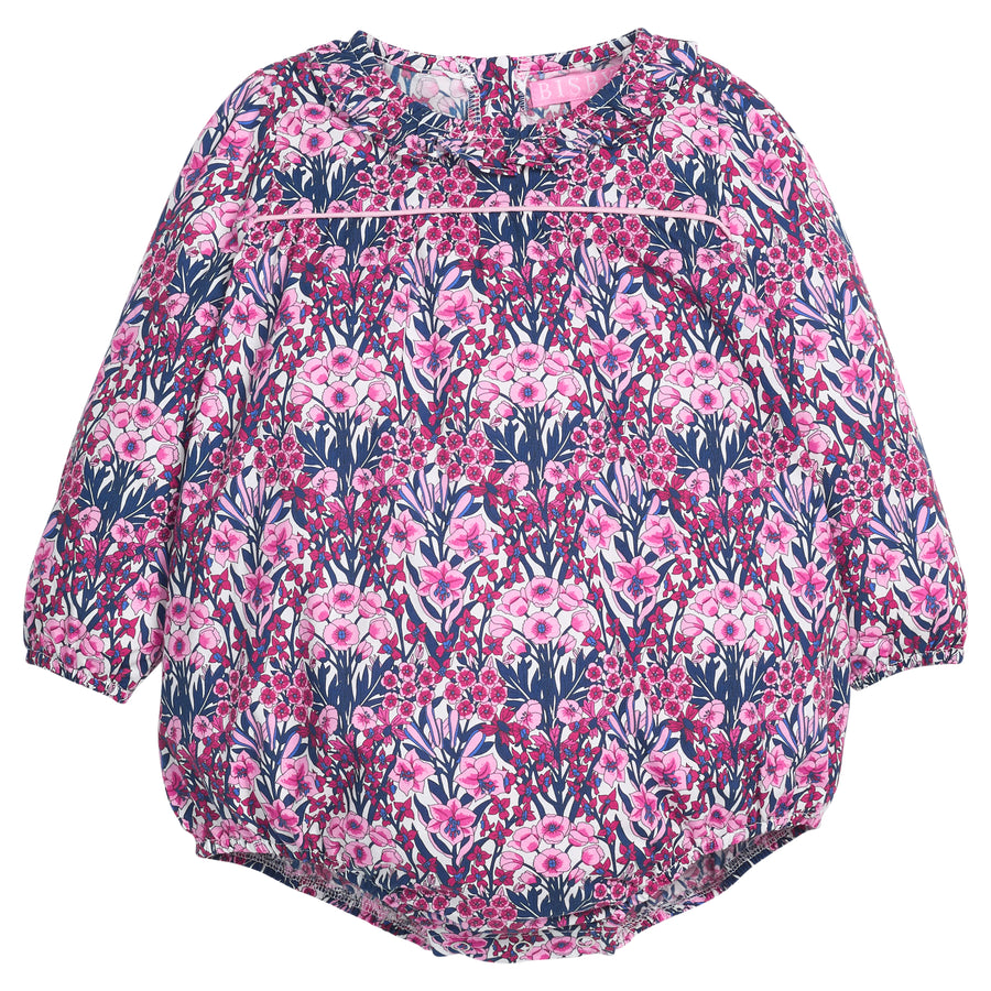 Navy and pink floral-patterned woven baby bubble that features button closure along back of neckline and at stride. 