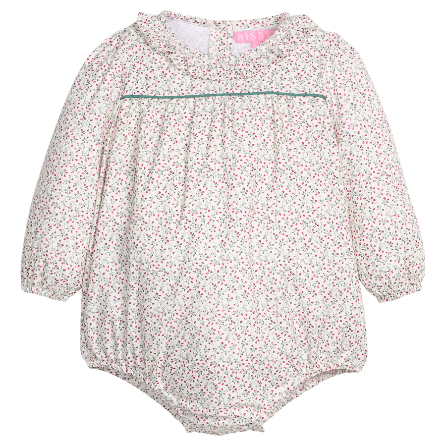 Baby girl woven bubble in a green and red floral print that features a button closure at back of neckline and at stride for easy put on/pull off access. 