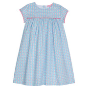Girl dress with blue and pink daisy chain print, with hot pink trim across bust area and sleeves