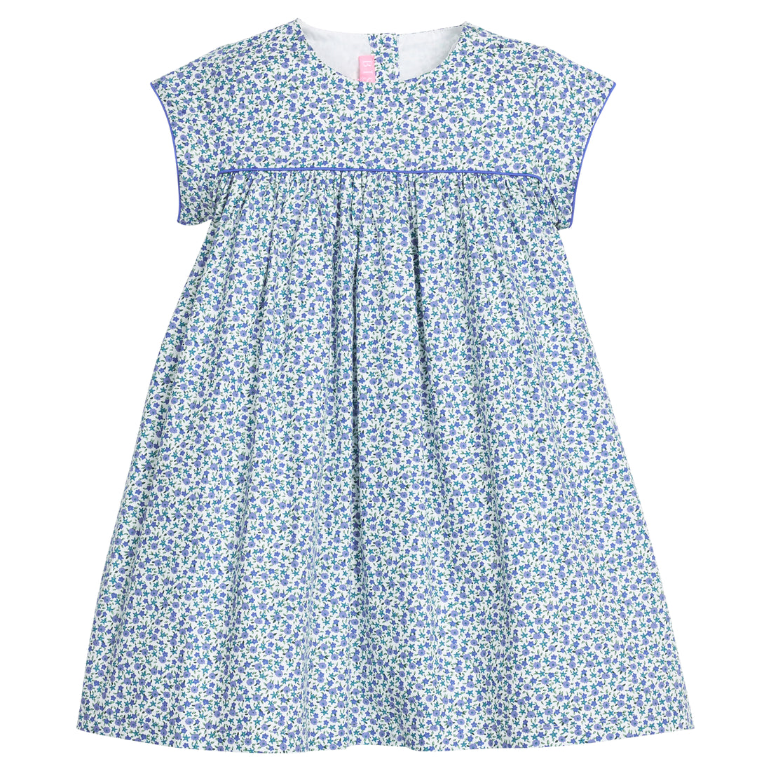 Girls woven short sleeve dress in a blue floral pattern that features button closure at back of neckline. Dress also features a blue trim across bust and end of sleeves for an elevated look. 