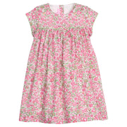 Girls pink and green floral dress with green piping along bust and trim of sleeves, that also features a four button closure along back of neckline. 