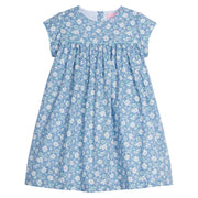 Girls dress featuring our Bedford Gardens Blue Floral. Dress has an aqua trim that goes along the ends of the short sleeves and across the bust of the dress. Dress also has buttons along back making it easy to get in and out of-BISBY