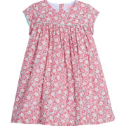 Girls dress featuring our Bedford Gardens Pink Floral. Dress has an aqua trim that goes along the ends of the short sleeves and across the bust of the dress. Dress also has buttons along back making it easy to get in and out of-BISBY