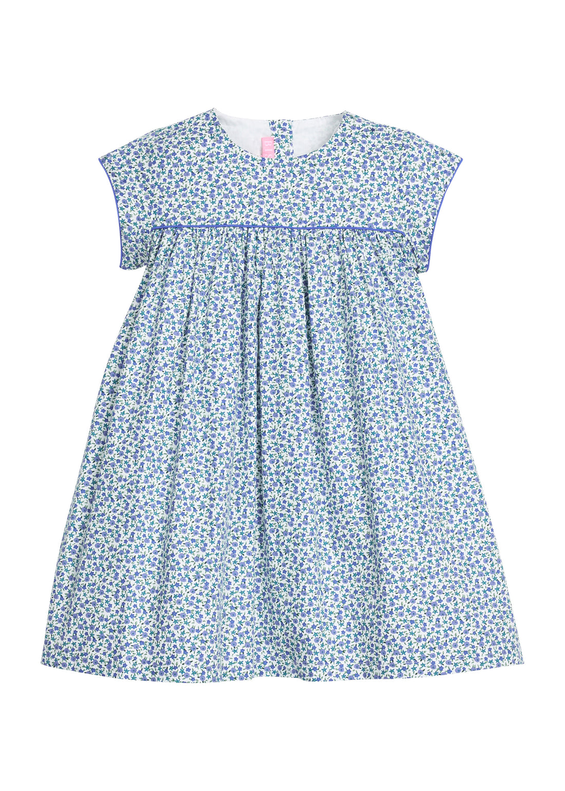 Girls woven short sleeve dress in a blue floral pattern that features button closure at back of neckline. Dress also features a blue trim across bust and end of sleeves for an elevated look. 