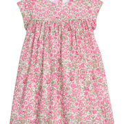Girls pink and green floral dress with green piping along bust and trim of sleeves, that also features a four button closure along back of neckline. 