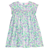 BISBY girl woven dress in an aqua/purple/blue floral print. Dress features three button closure at back and matching purple trim across bust and end of sleeves for a completed look. 