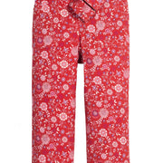 Girls red floral woven pant that features a button closure, two functioning pockets, and a functioning belt to complete the look.