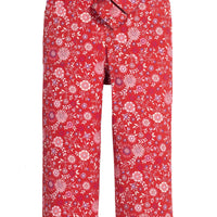 Girls red floral woven pant that features a button closure, two functioning pockets, and a functioning belt to complete the look.