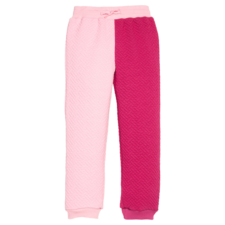 Girls pink and magenta quilted pants with one leg being a bubblegum pink and the other in a cranberry pink. Joggers also feature an elastic waistband and functioning ties.