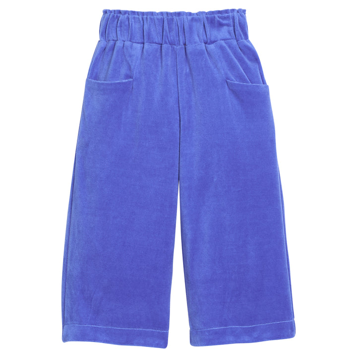 Girls velour pants in royal blue that feature functioning pockets in the front of pants and an elastic waistband. 