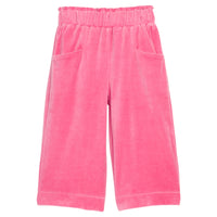 Girls pink velour palazzo pants that feature two functioning pockets in the front and an elastic waistband. 