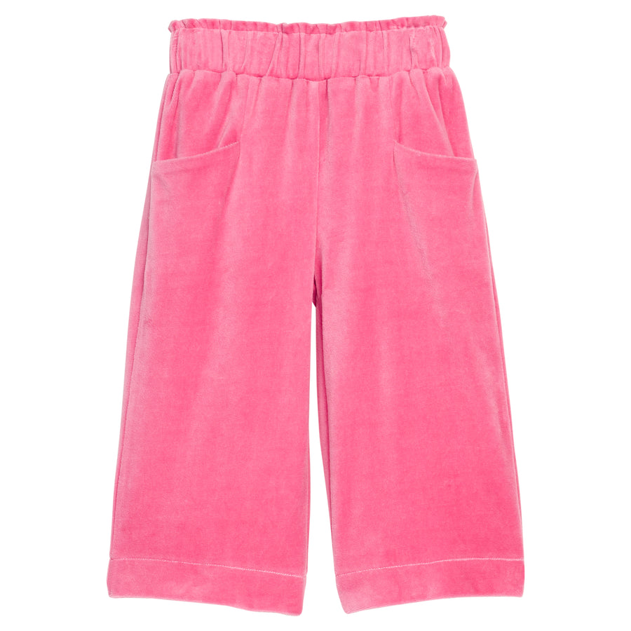 Girls pink velour palazzo pants that feature two functioning pockets in the front and an elastic waistband. 