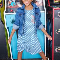 Little girl seen wearing our Everyday Dress in French Blue Stripes/ Merion Floral pocket-paired with our jean jacket--BISBY girls