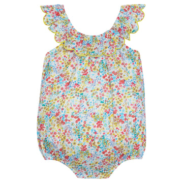 Baby girl bubble with ruffles around the neckline. Vibrant floral arrangement of yellow, blue, and red with buttons at the stride.