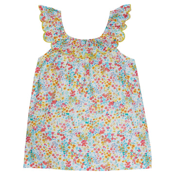 Girl/tween top with a yellow trim scalloped neckline, with red, yellow, blue floral print. 