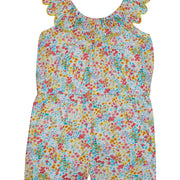 Girl/tween romper with pockets, has scalloped neckline with yellow trim and an elastic waistband, and beautiful red, yellow, and blue floral print