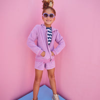 BISBY girl in our Navy/White/Metallic Stripe shirt paired underneath our Hoodie Short Set in Lilac Terry