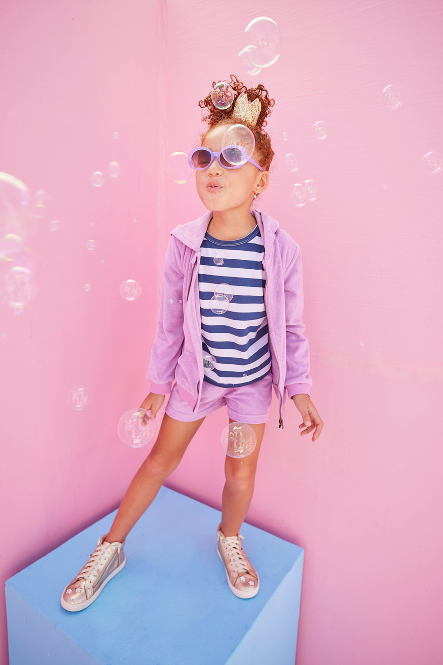 BISBY girl in our Navy/White/Metallic Stripe shirt paired underneath our Hoodie Short Set in Lilac Terry