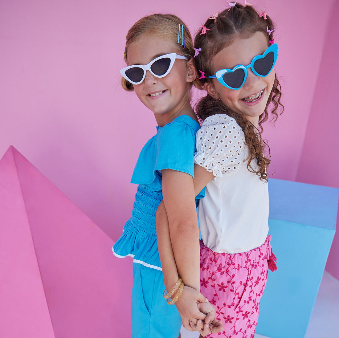Blue Basic Shorts in our rayon blend material with an elastic waistband and pockets paired with our India Top in Blue. Other model can also be seen wearing our new Richmond Shorts in Pink Eyelet paired with our Contrast Sleeve Tee in White Eyelet.