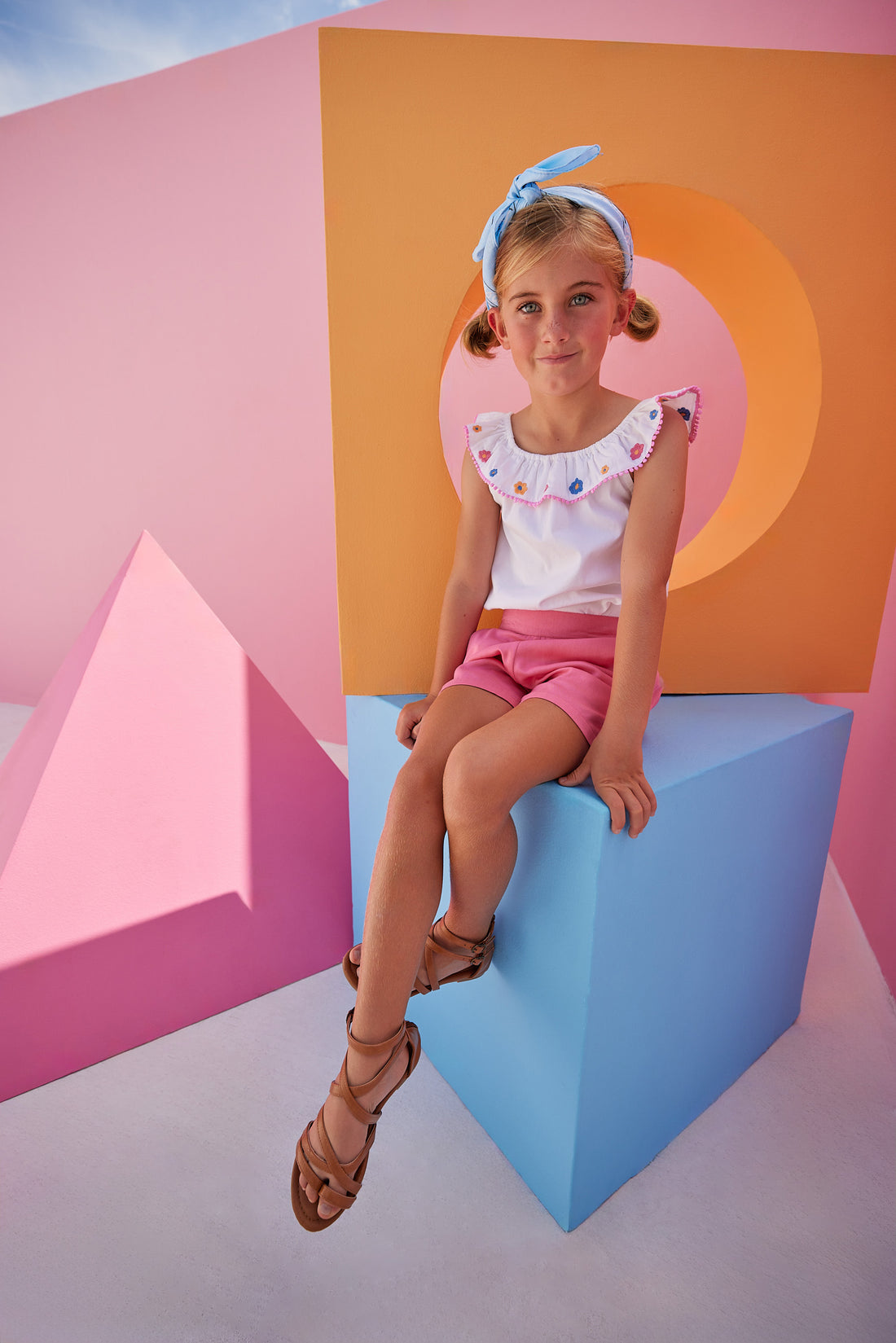 Model can be seen wearing our new Pink Basic Shorts in our rayon blend fabric which has an elastic waistband and pockets. We have paired the Kate Top in our Flower Market Embroidery.