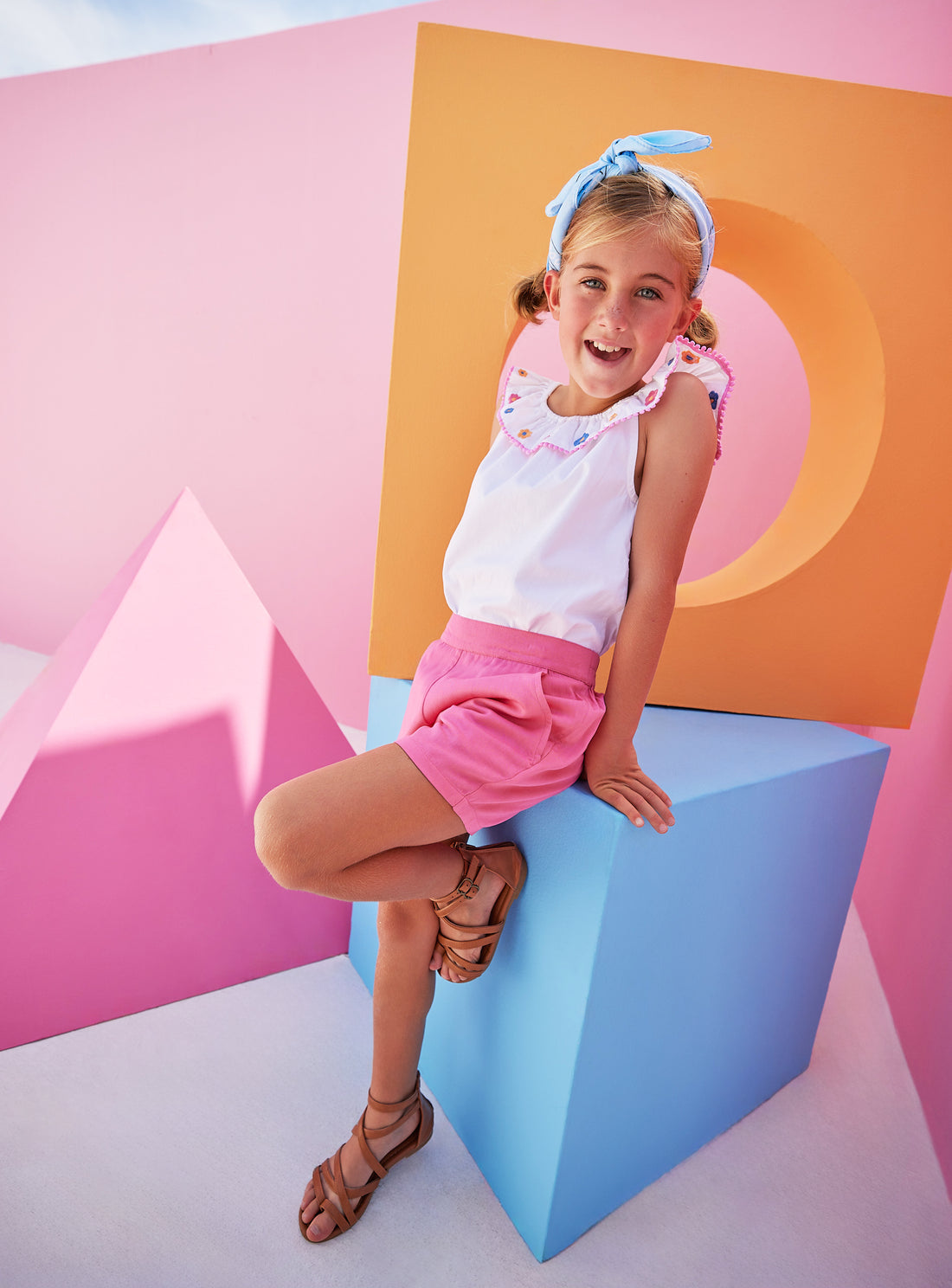 Model can be seen wearing our new Pink Basic Shorts in our rayon blend fabric which has an elastic waistband and pockets. We have paired the Kate Top in our Flower Market Embroidery.