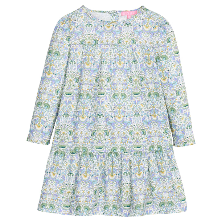 Girls/tween woven long sleeve dress in a blue/green/white floral print. Dress features two tiers and pleating detail and button closure at back for easy put on/take off access.