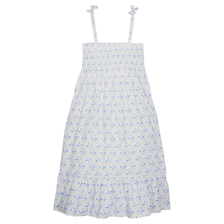 Tween dress with faux tie straps that has ruching across bust that has a green and blue floral print on top of white background.