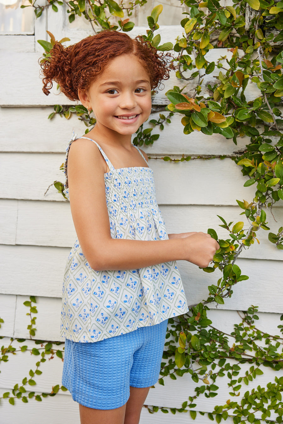 BISBY girl rocking our new Lucy Top in Vintage Azur which features a beautiful blue and green floral pattern. This top has fixed ties on the straps for an elevated look and also has ruching across the bust. 