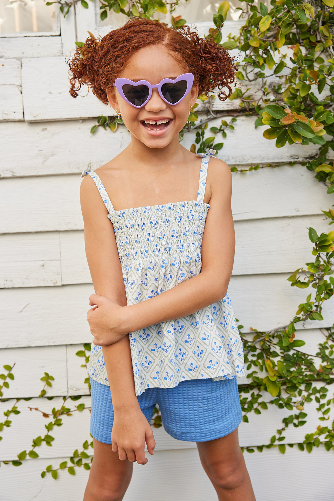 BISBY girl rocking our new Lucy Top in Vintage Azur which features a beautiful blue and green floral pattern. This top has fixed ties on the straps for an elevated look and also has ruching across the bust. 