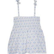 Girl/tween top that has faux tie straps with ruching across bust with blue and green floral print on a white background.