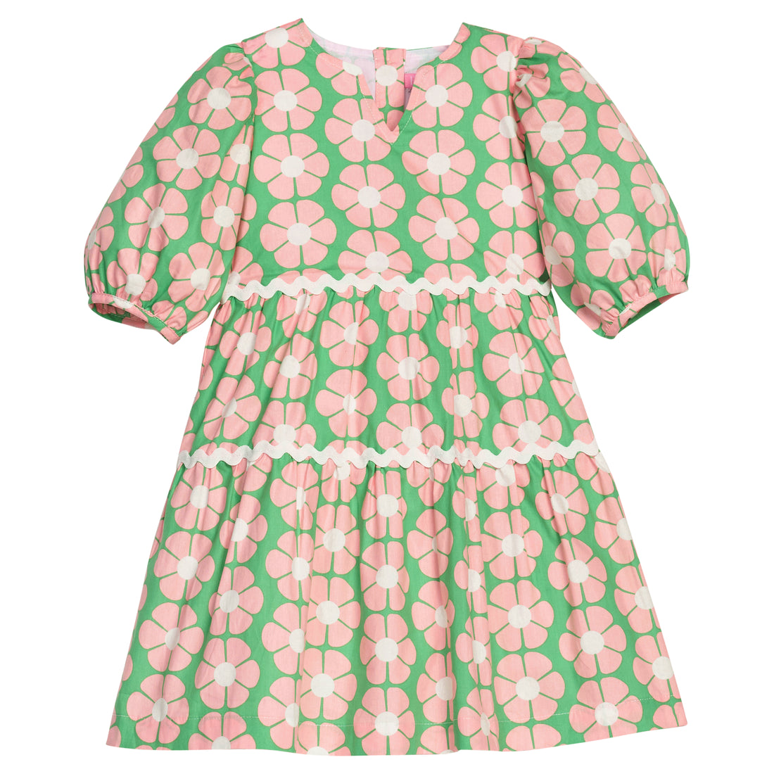 BISBY girl woven white dress in salmon pink/green floral print. Dress features three button closure along back, elastic cuffs at sleeve, and cream ric rac detail across tiers of dress for an elevated look.