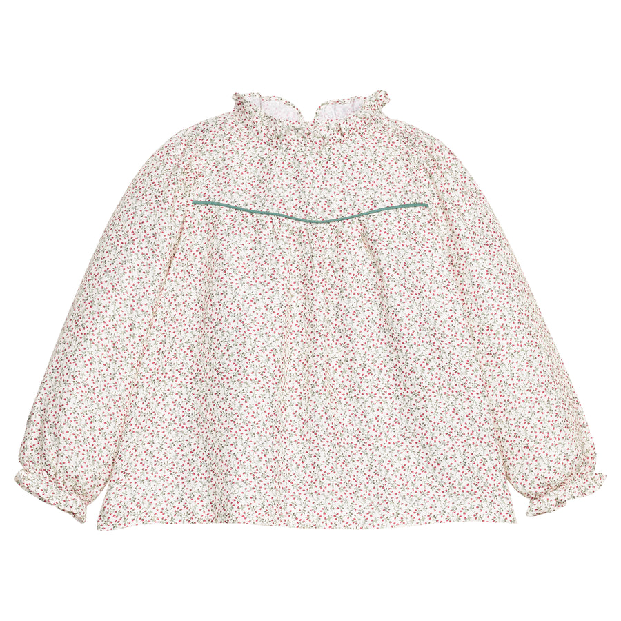 Girls/tween woven long sleeve top in a green and red floral print that features a high neck ruffle neckline, button closure at back,  and a green trim detail across the bust to elevate the look. 