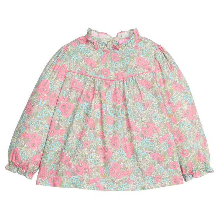 Girls/tween woven long sleeve top in a pink/green/teal floral print that features a high neck ruffle neckline, button closure at back,  and a pink trim detail across the bust to elevate the look. 