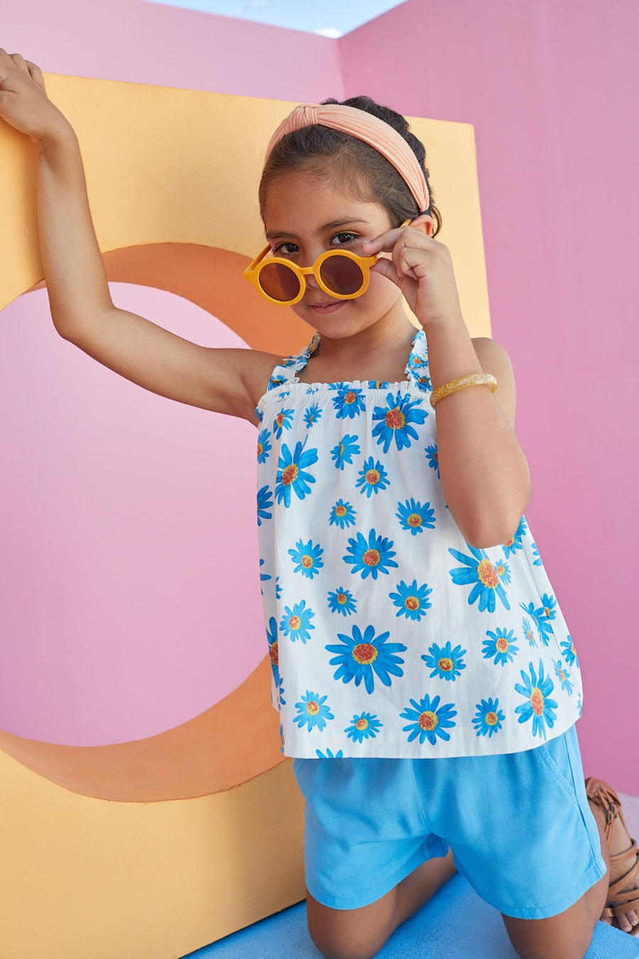 Tween girls top with BISBY blue flower pattern and square neck. 