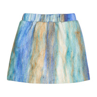 Girls/tween mini skort in a blue multi color wool material. Skort features an elastic waistband and built in shorts for a secure but relaxed fit. 