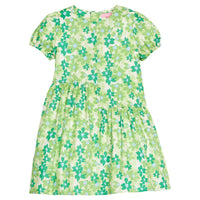 BISBY girl woven dress in a green/light blue floral print. Dress features an asymmetrical cut body, elastic cuffs at sleeves, and a zipper closure along back of dress. 