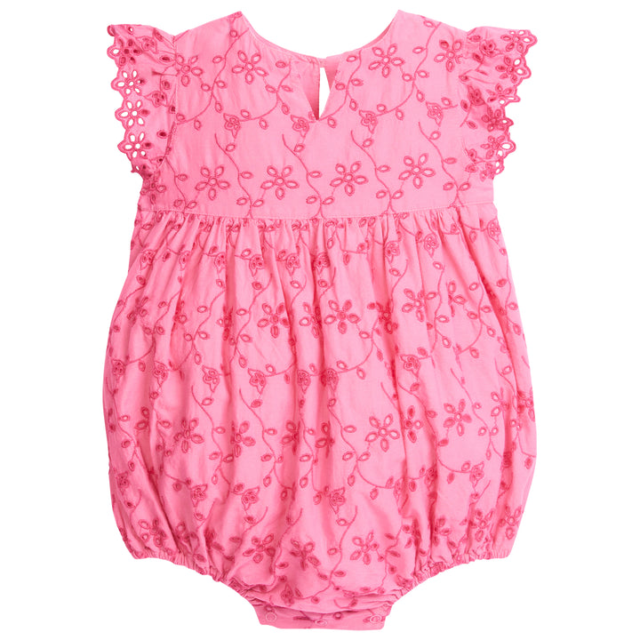 Baby girl light pink v-neck bubble that has a hot pink eyelet embroidered floral pattern across it. The sleeves are also an angel sleeve with a hot pink eyelet trim.
