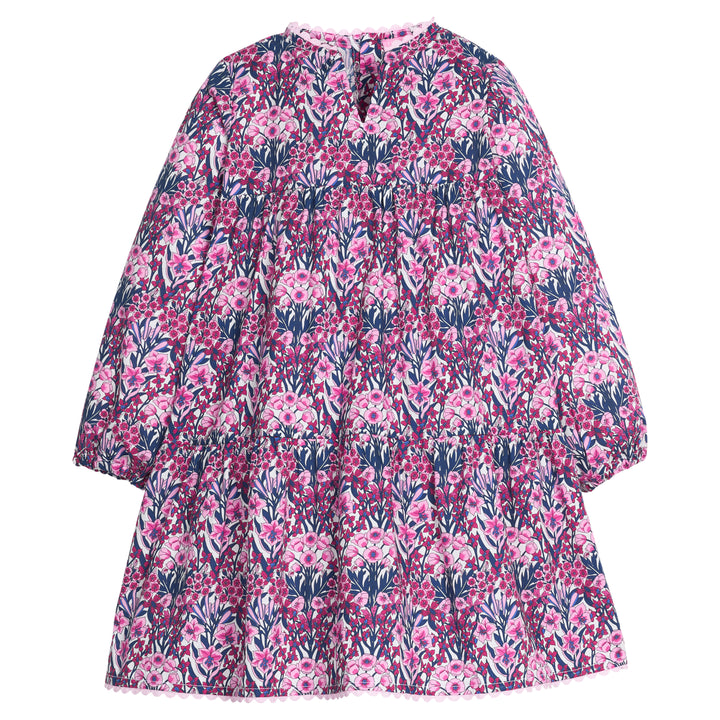 Girls/tween woven long sleeve dress in a navy/pink/cranberry color that features a slight v-neckline, ric rac detail along neckline and bottom tier of dress, and button closures along back of dress. 
