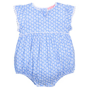BISBY baby knit bubble in a blue and white floral print. Bubble features button closure along back and stride, white ric rac detail across the middle/bust area, and white ric rac detail along sleeve cuffs for an elevated look. 