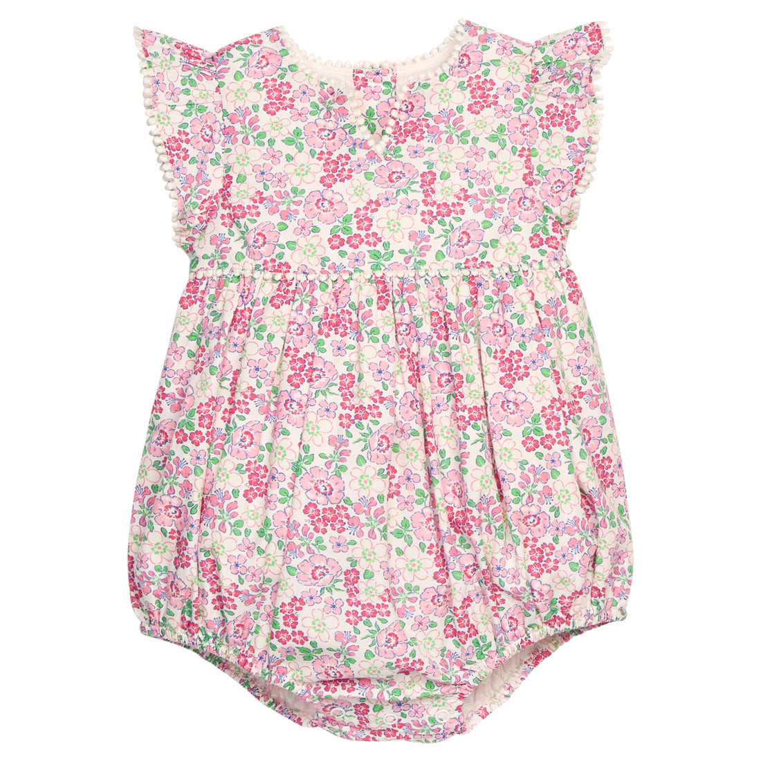 BISBY baby knit bubble in a pink/green floral print. Bubble features button closure along back and stride, white pom pom detail across the middle/bust area, and white pom pom detail along sleeve cuffs for an elevated look.