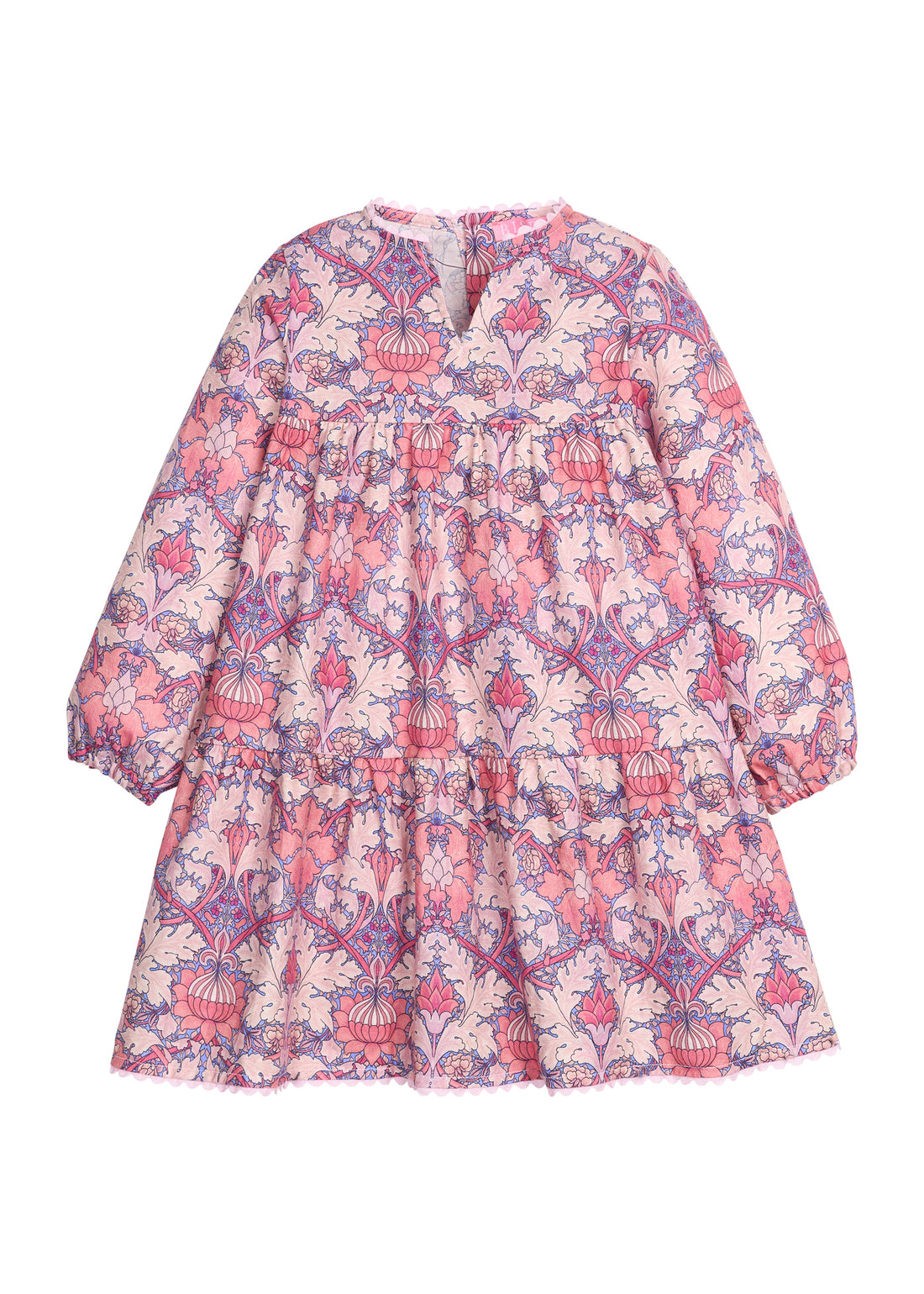 Girls/tween woven dress in a purple/pink floral pattern that features button closures at back, ric rac detail along neckline and bottom of dress, and elastic cuffs at sleeves for a secure but relaxed fit. 
