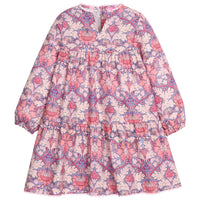 Girls/tween woven dress in a purple/pink floral pattern that features button closures at back, ric rac detail along neckline and bottom of dress, and elastic cuffs at sleeves for a secure but relaxed fit. 

