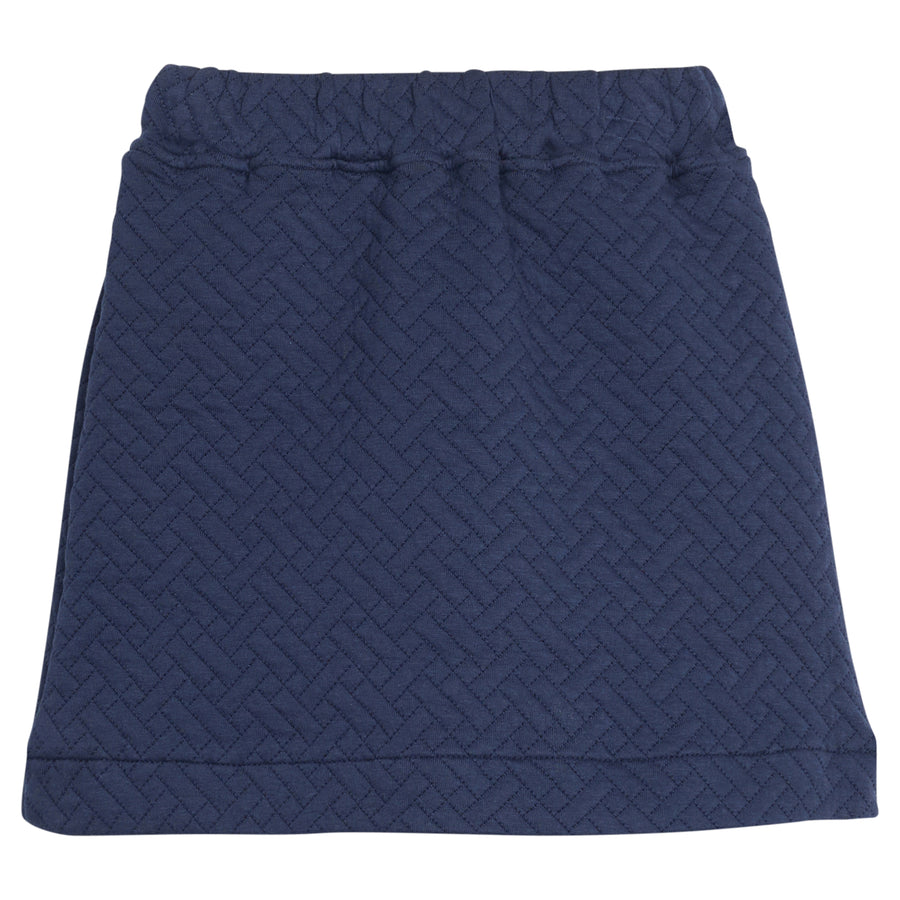 Girls/tween quilted mini skort in navy that features an elastic waistband and built in shorts for a secure but relaxed fit. 