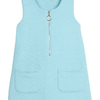 Girls/tween quilted jumper in aqua that features functional pockets in front of jumper and gold quarter zip sweater for an elevated look.