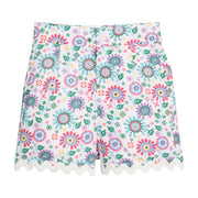 BISBY girl woven ric rac shorts in a beautiful rainbow colored floral. Shorts feature a button closure at front, pockets, and white ric rac detail along bottom of shorts for an elevated look.
