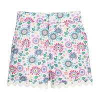 BISBY girl woven ric rac shorts in a beautiful rainbow colored floral. Shorts feature a button closure at front, pockets, and white ric rac detail along bottom of shorts for an elevated look.