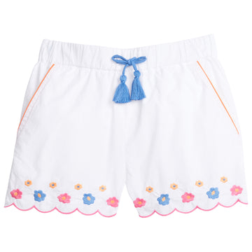 Girl/teen shorts with pockets that have an orange trim and blue faux tassel ties. Shorts also have embroidered blue, orange, and pink floral pattern along bottom of short, which also have a scalloped pink trim along bottom.
