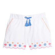 Girl/teen shorts with pockets that have an orange trim and blue faux tassel ties. Shorts also have embroidered blue, orange, and pink floral pattern along bottom of short, which also have a scalloped pink trim along bottom.