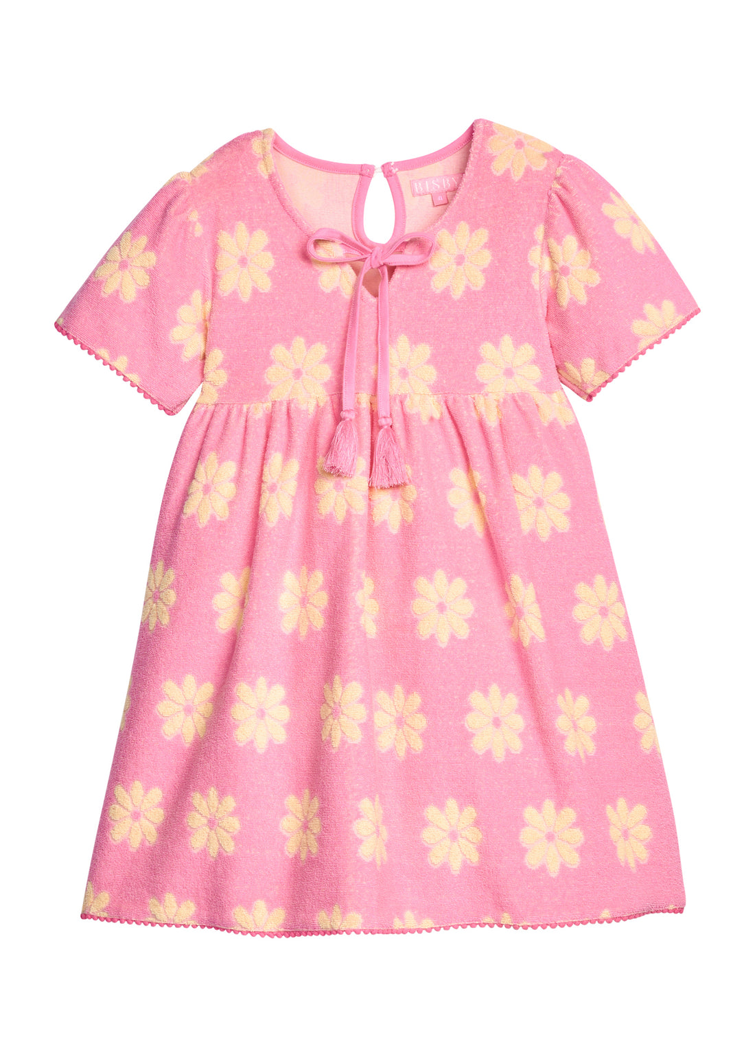 BISBY girl terry knit dress in bubblegum pink with yellow floral pattern. Dress features a keyhole button closure at back, tie tassel feature at v-neckline, and pink pom pom details at sleeve ends and bottom of dress to elevate the look. 
